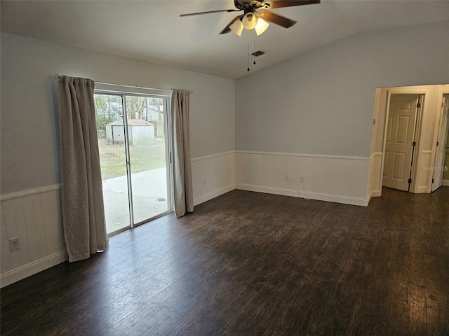 unfurnished room with vaulted ceiling, dark hardwood / wood-style floors, and ceiling fan