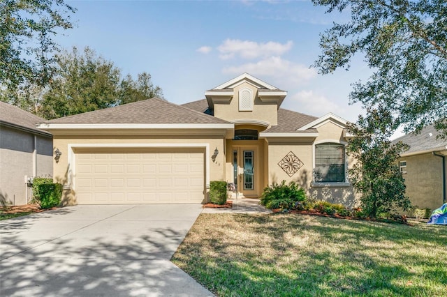 view of front of house featuring a garage and a front yard