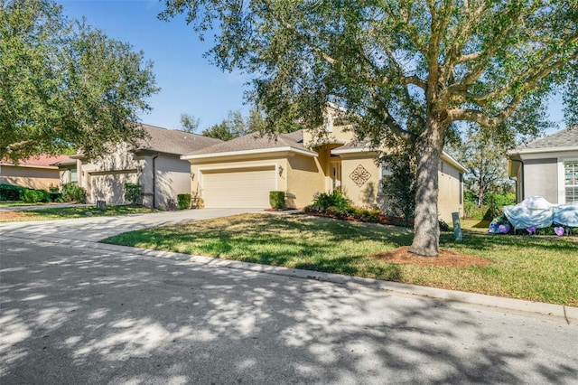 view of front facade featuring a garage and a front lawn