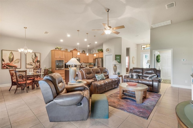 living room featuring light tile patterned flooring, ceiling fan with notable chandelier, and high vaulted ceiling