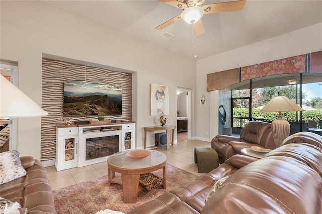 living room with light tile patterned floors and ceiling fan