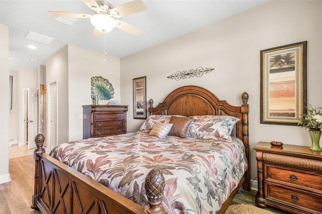 bedroom featuring ceiling fan and light hardwood / wood-style floors