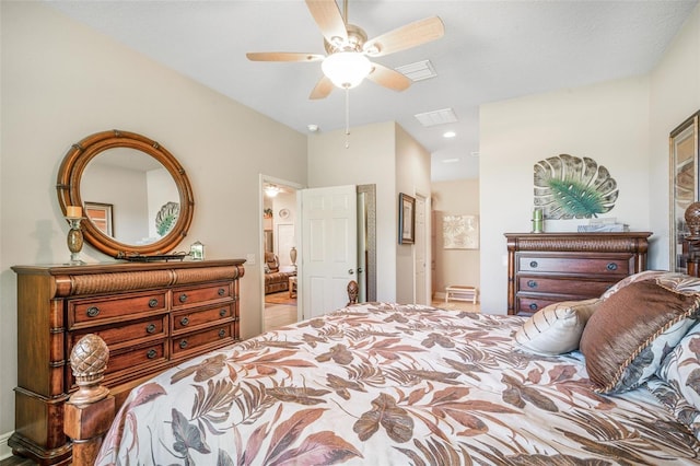 bedroom featuring ensuite bath and ceiling fan