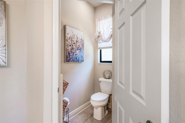 bathroom featuring tile patterned floors and toilet