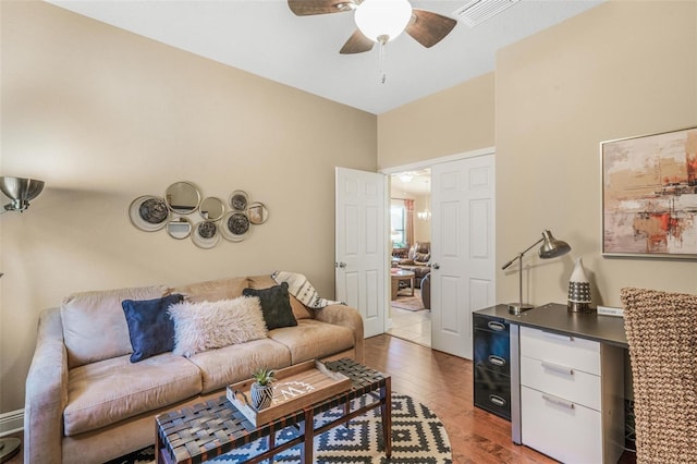 living room featuring hardwood / wood-style flooring and ceiling fan