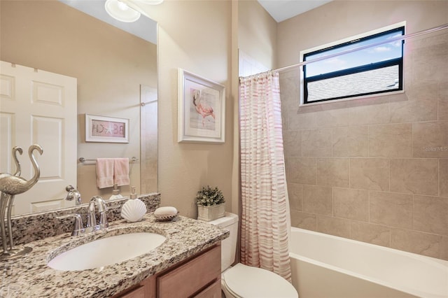 full bathroom with vanity, toilet, and shower / bath combo