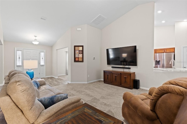 living room featuring vaulted ceiling and light carpet