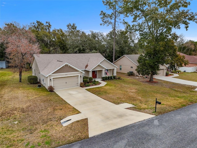 view of front facade with a garage and a front lawn