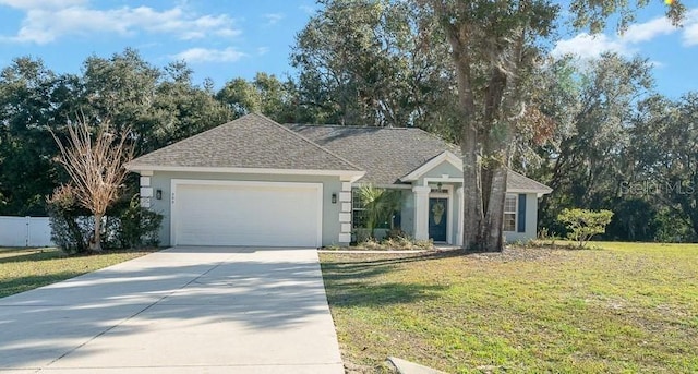 ranch-style home featuring a garage and a front yard