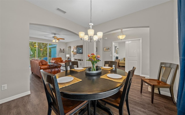 dining area featuring ceiling fan and dark hardwood / wood-style floors