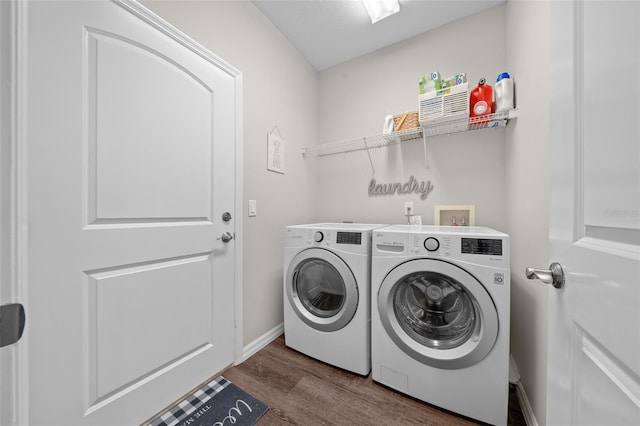 laundry room with dark hardwood / wood-style flooring and separate washer and dryer