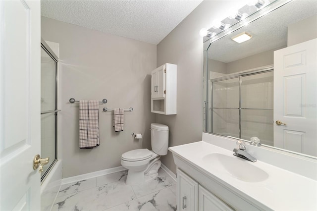 full bathroom featuring vanity, combined bath / shower with glass door, a textured ceiling, and toilet