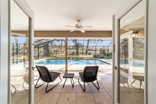 view of swimming pool featuring pool water feature and ceiling fan