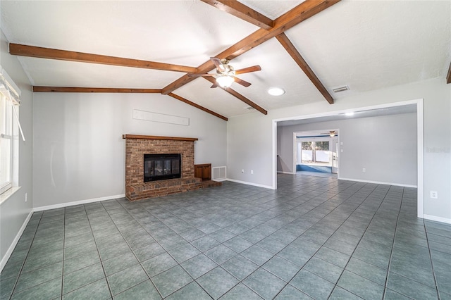 unfurnished living room with ceiling fan, lofted ceiling with beams, a fireplace, and visible vents