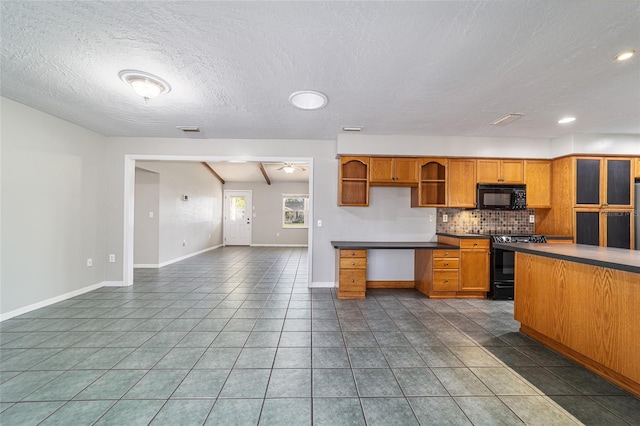 kitchen featuring decorative backsplash, dark tile patterned flooring, black appliances, and open shelves