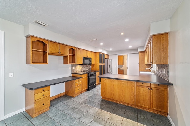 kitchen with open shelves, dark countertops, backsplash, a peninsula, and black appliances