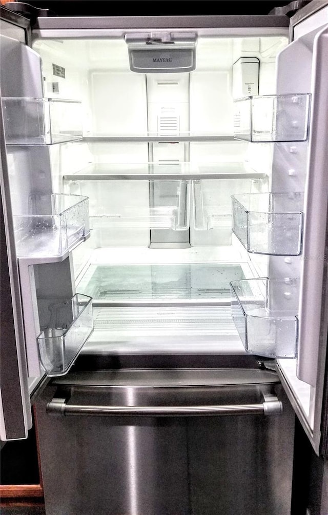 room details featuring stainless steel fridge