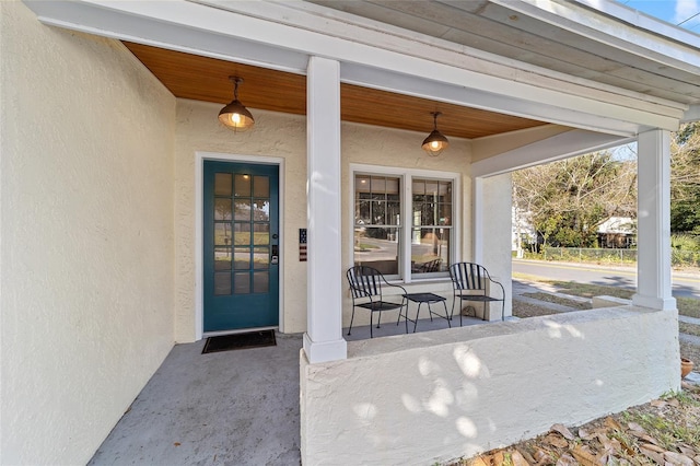 doorway to property with covered porch