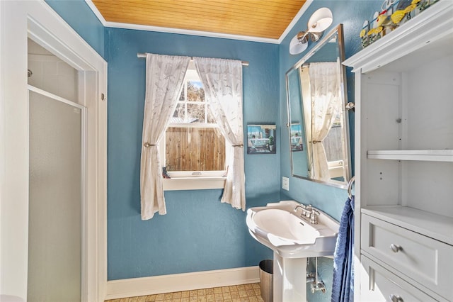 bathroom featuring wood ceiling and ornamental molding