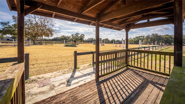 wooden deck featuring a rural view