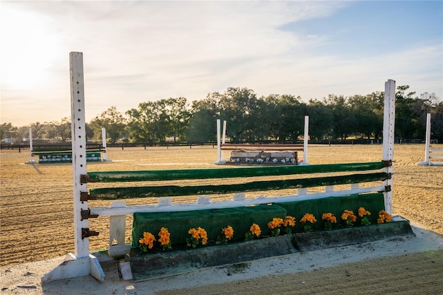 view of home's community with fence and a yard