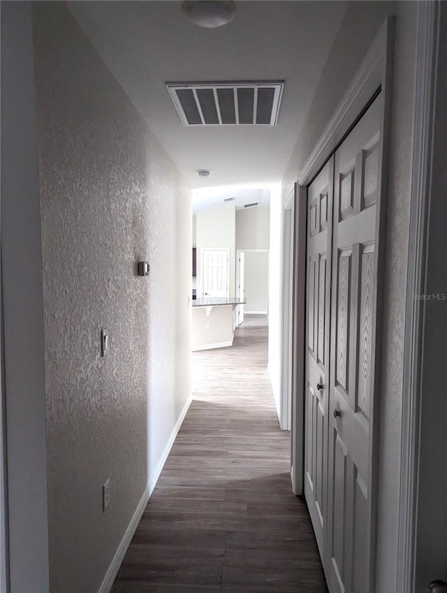 hallway featuring wood-type flooring