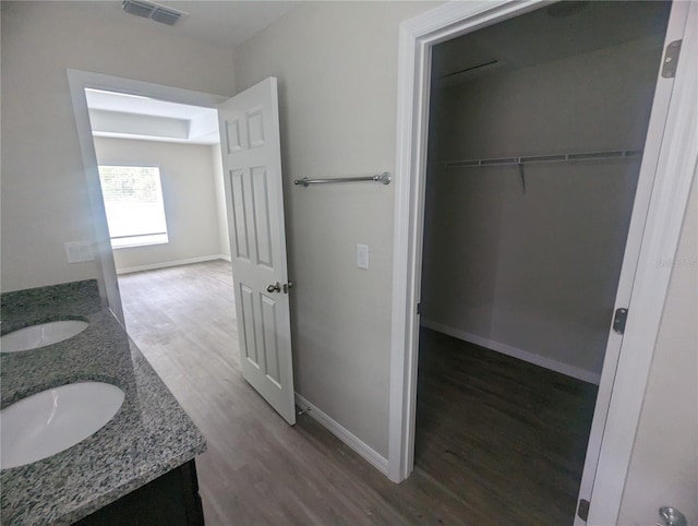 bathroom featuring vanity and hardwood / wood-style flooring