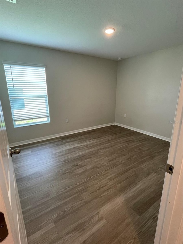 2792 SW 161st Loop, Ocala, FL 34473 - empty room featuring dark wood-style flooring, baseboards, and recessed lighting
