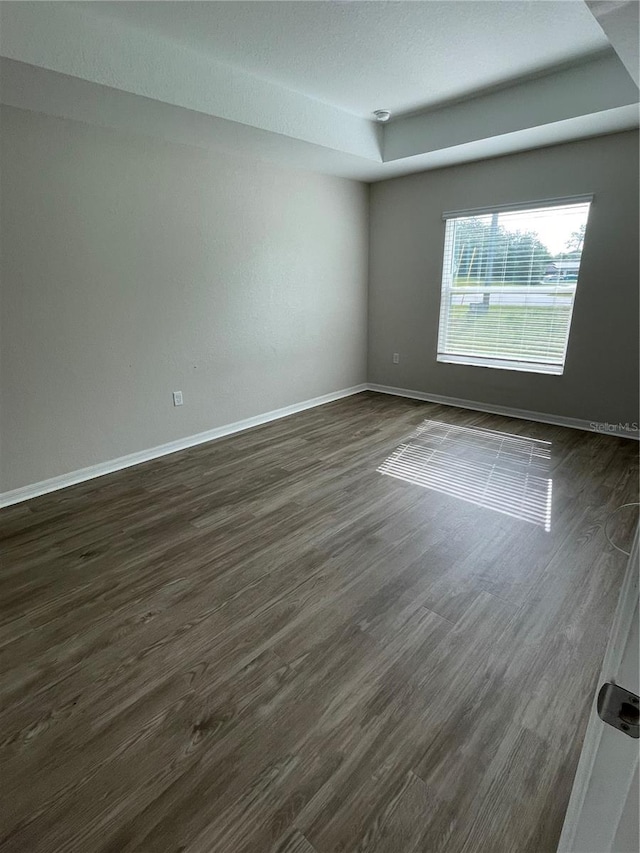 2792 SW 161st Loop, Ocala, FL 34473 - spare room with dark wood-type flooring and baseboards