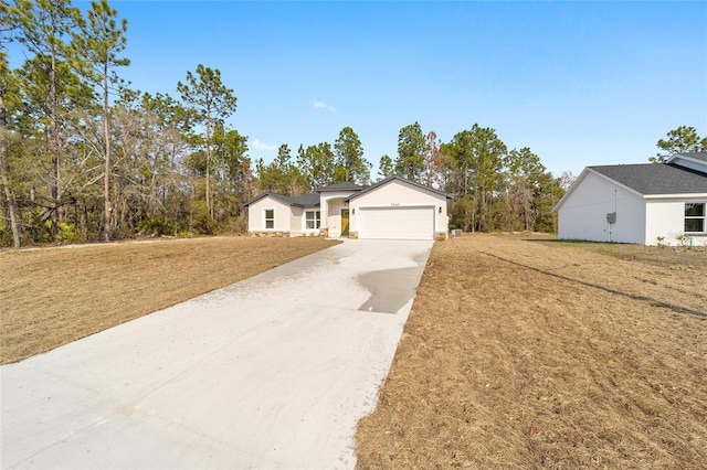 view of front of home with a garage and a front yard