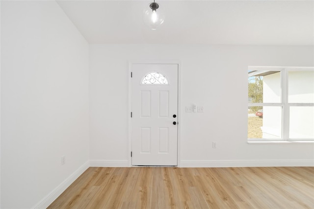 foyer entrance with light hardwood / wood-style floors