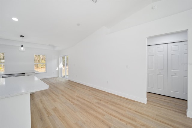 unfurnished living room with lofted ceiling and light hardwood / wood-style floors