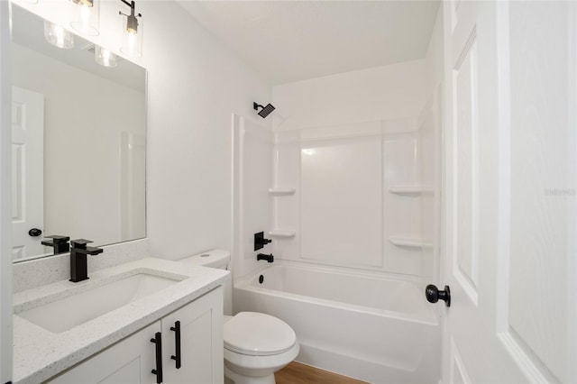 full bathroom featuring vanity, tub / shower combination, and toilet