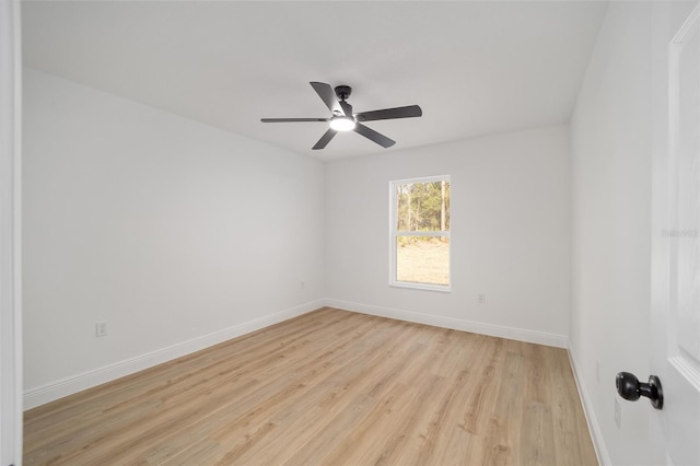 empty room with ceiling fan and light hardwood / wood-style floors