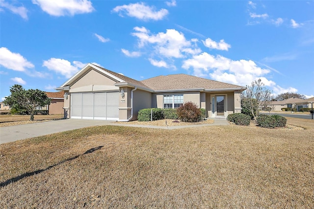 ranch-style home featuring a garage and a front lawn