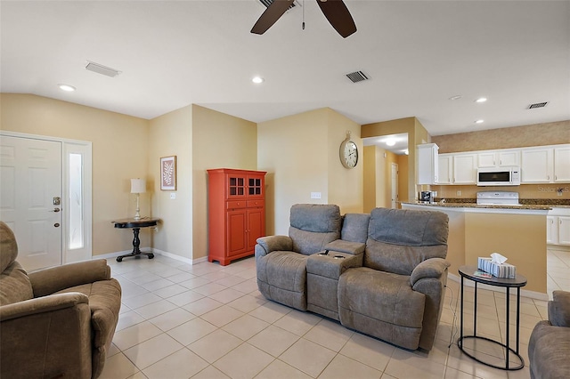 tiled living room with ceiling fan