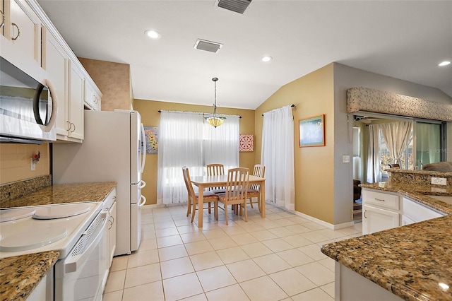 kitchen with pendant lighting, light tile patterned floors, lofted ceiling, and white cabinets