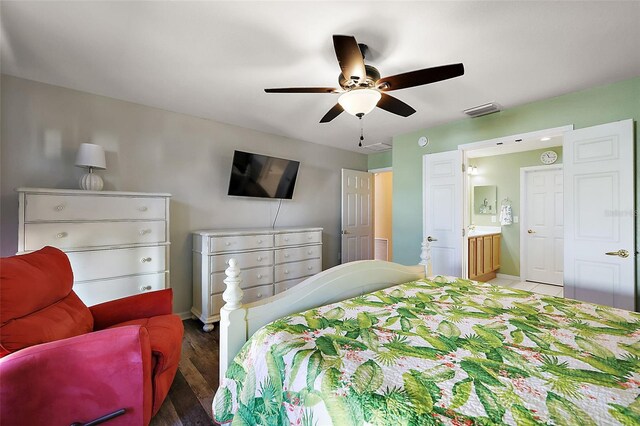 bedroom featuring ceiling fan, connected bathroom, and dark hardwood / wood-style floors