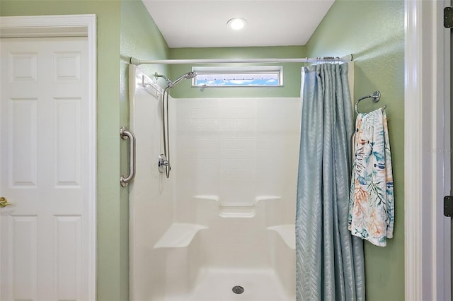 bathroom featuring curtained shower