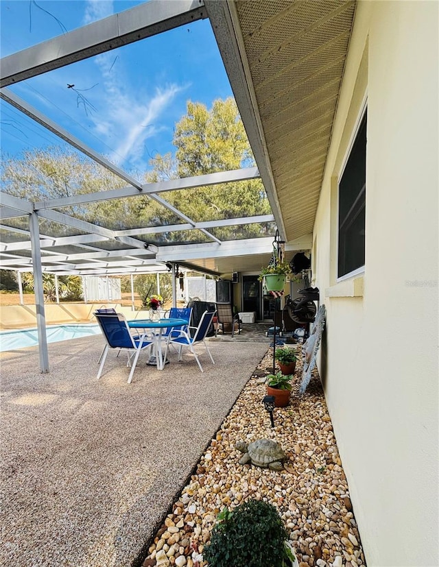 view of patio / terrace with glass enclosure