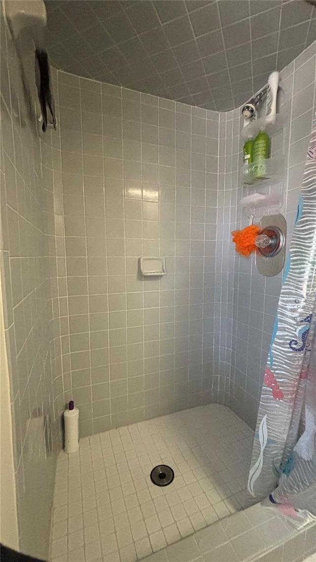 bathroom with a tile shower