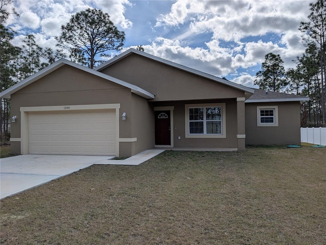 view of front of property with a garage and a front yard