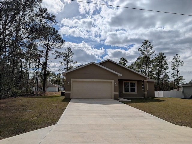 view of front of property featuring a garage and a front yard