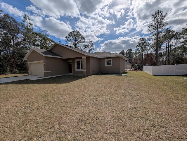 view of front facade with a garage and a front lawn