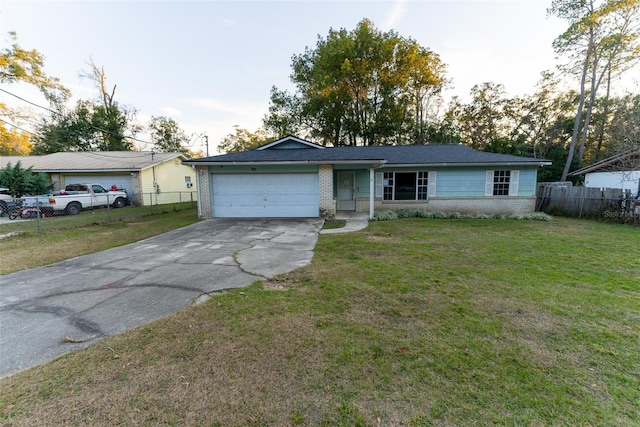 ranch-style home featuring a garage and a front lawn