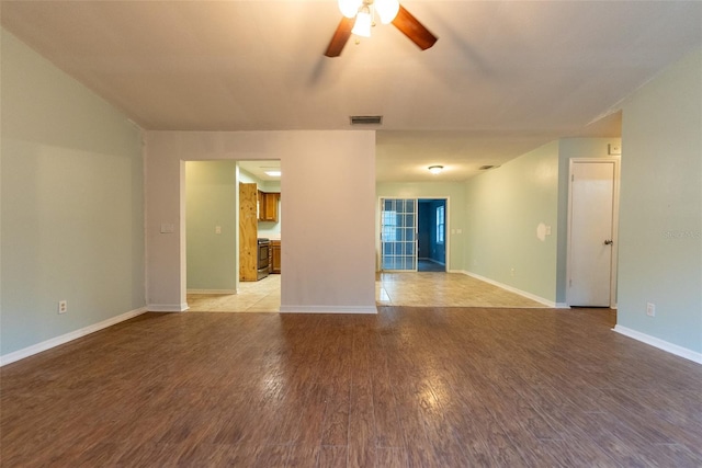 unfurnished room with ceiling fan and light hardwood / wood-style floors