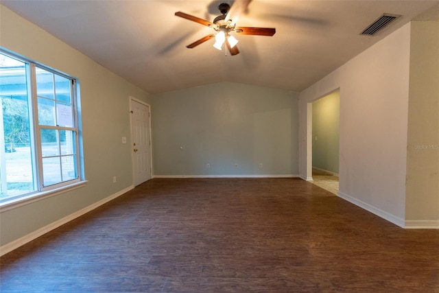 spare room with ceiling fan, lofted ceiling, and dark hardwood / wood-style floors