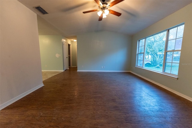 empty room featuring lofted ceiling, dark hardwood / wood-style floors, and ceiling fan