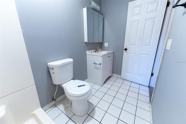 bathroom featuring vanity, tile patterned floors, and toilet