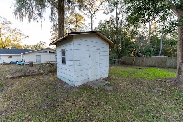 view of outbuilding with a lawn